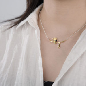 person wearing the honey bee necklace made out sterling silver - phoenexia